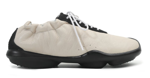 Drawing inspiration from early wall climbing shoes, when performance was close to the body.